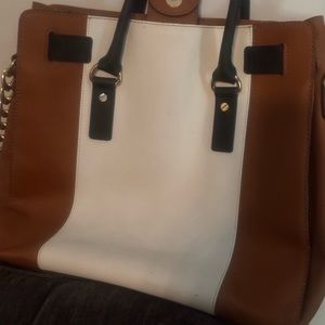 Large Michael Kors handbag. Has some wear and tear but still beautiful!